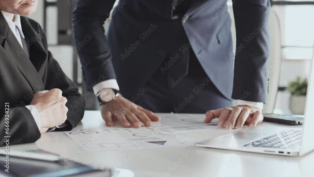 Poster midsection shot of unrecognisable businessman standing and explaining information in project documen