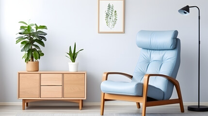 Wooden recliner chair with blue leather cushion near cabinet and side table against white wall with poster frame. Scandinavian or mid-century interior design of modern living room