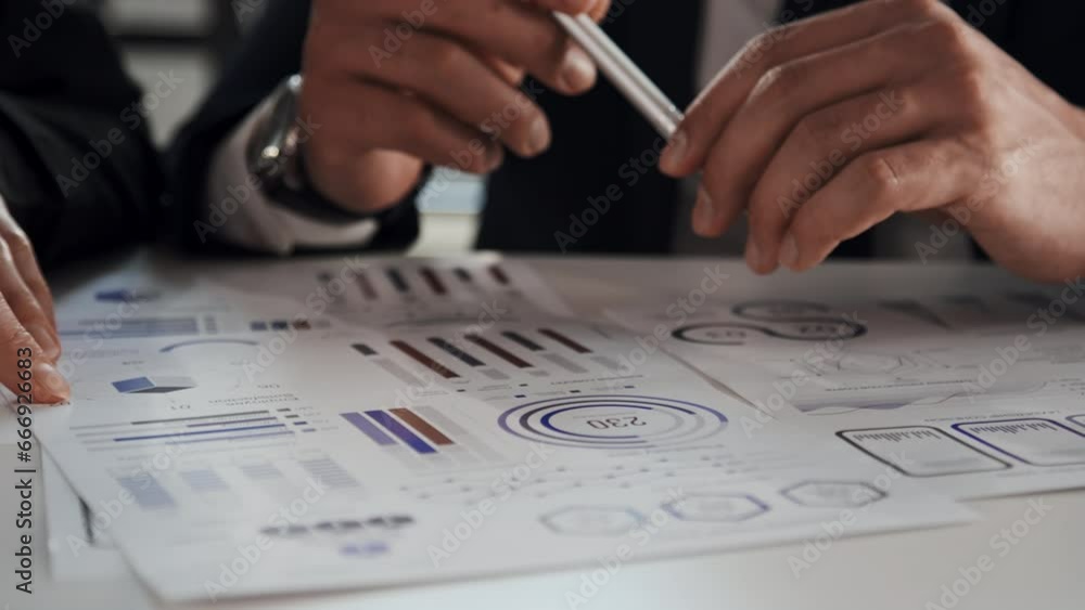 Poster close up shot of two unrecognizable business partners hands pointing at information in new project d