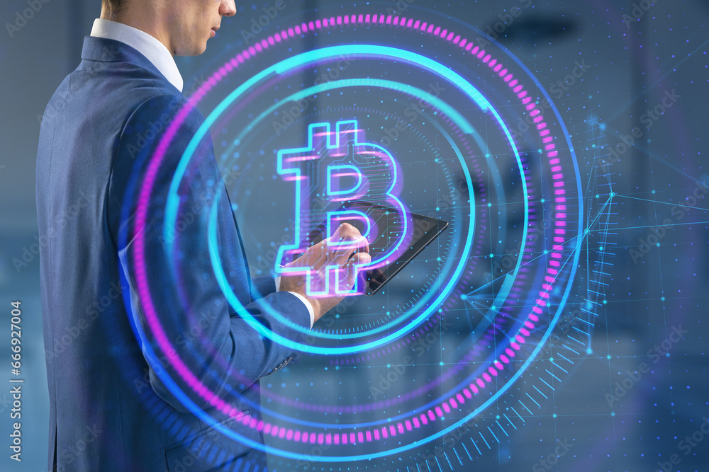 Poster headless white businessman using tablet with glowing round polygonal bitcoin hologram on blurry offi