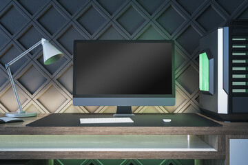 Creative gamers desktop with empty computer screen, lamp and system unit on decorative black wall background. Gaming concept. Mock up, 3D Rendering.