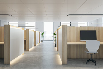 Modern coworking office interior with partitions and workplaces, window with city view and...