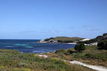 Beautiful coastal image of Rottnest Island off the West Australian coast.  Showing clear water, waves, limestone rocks and vegetation