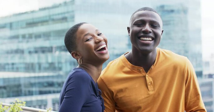 Portrait of smiling african american business people in office, slow motion, copy space