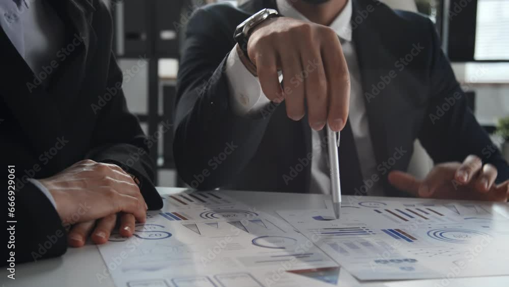 Poster cropped slowmo of young unrecognizable businessman showing and explaining new project efficiency on 