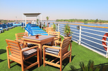 Sundesk on cruise ship. A place to relax, tables and lounger on the deck. Luxury Nile Cruise, Egypt, Africa. Summer vacation, relaxing on cruise ships