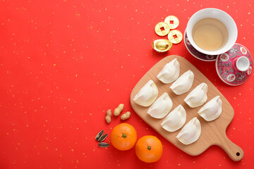 Delicious dumplings on a red background in China. The Chinese meaning in the picture is: attracting...