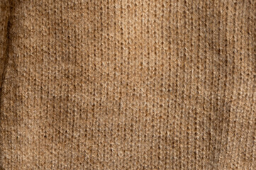 Stylized fashionable look. Beige knitted sweater. Close-up knitting texture. Social media background.