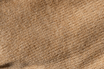 Stylized fashionable look. Beige knitted sweater. Close-up knitting texture. Social media background.