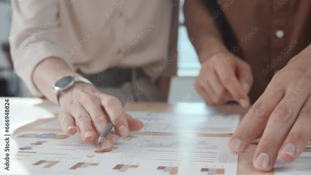Poster close up slowmo of two unrecognizable colleagues discussing expected statistical data of new project