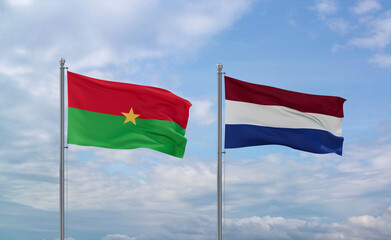 Netherlands and Burkina Faso flags, country relationship concept