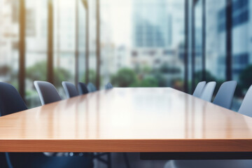 Empty wooden meeting table. Blurred modern office in the background