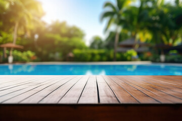 Fototapeta premium empty wooden table on background blurred empty swimming pool outdoors in daylight