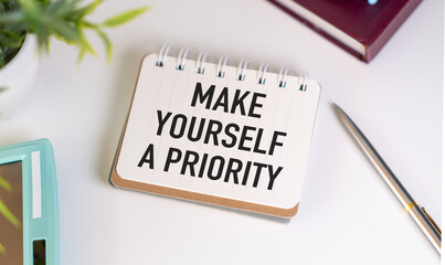 Notebook with text written - Make Yourself a Priority