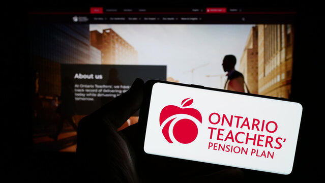 Stuttgart, Germany - 10-13-2023: Person holding smartphone with logo of organization Ontario Teachers' Pension Plan Board (OTPP) in front of website. Focus on phone display.