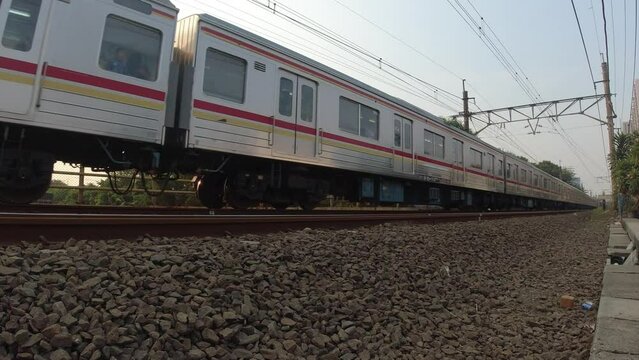commuter line train passing by. low-angle footage