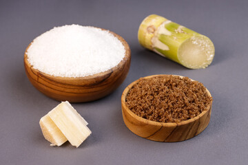 Various types of Sugar, Brown Sugar and White Sugar with Sugar Cane.