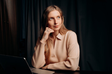 Business woman on a dark background