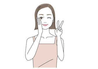 ウインクしながら笑顔でVサインをしているキャミソール姿の女性