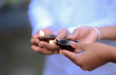hand holding a burning match