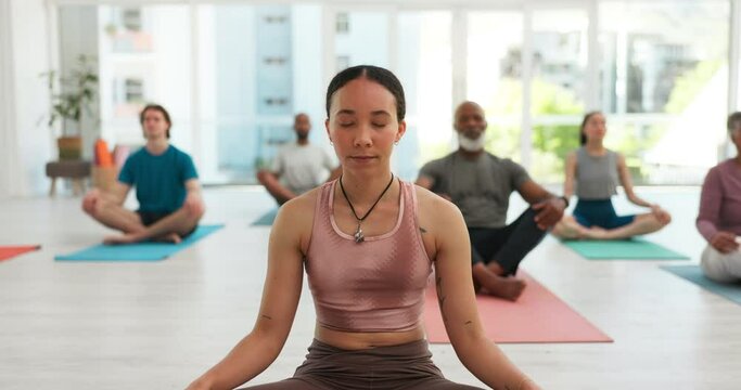 Meditation, yoga club and people in lotus pose at gym for fitness or peace, zen or mental health balance. Breathe, exercise or woman guide with group for energy workout, wellness or holistic training