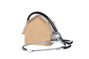 PNG,Toy wooden house with a stethoscope, isolated on white background