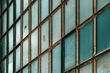 Fototapeta premium Old factory warehouse grid windows with broken glass
