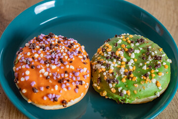 Plate for delicious donuts for Halloween on table
