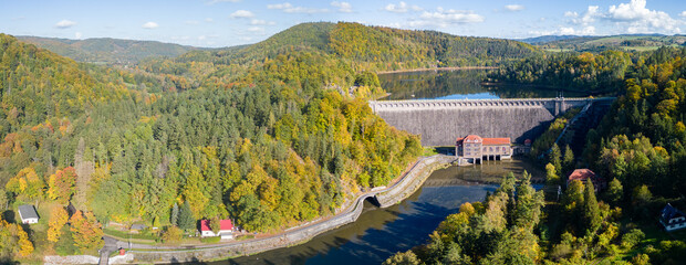 Fototapeta na wymiar Old hydroelectric power plant with a dam in the Bobr River Valley near Jelenia Góra