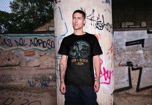 Mockup of young man wearing customizable t-shirt by graffiti, flash