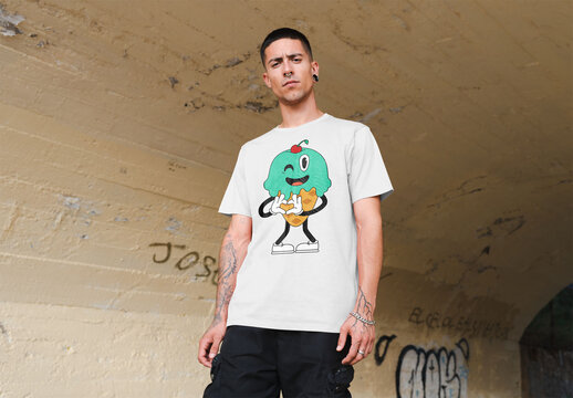 Mockup of young man wearing customizable t-shirt in underpass