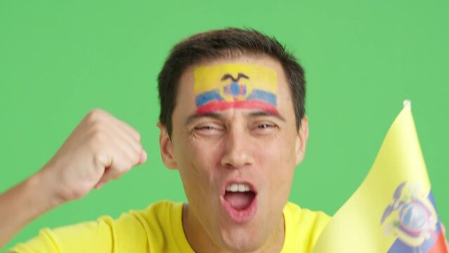 Close up of a man supporting ecuadorian team
