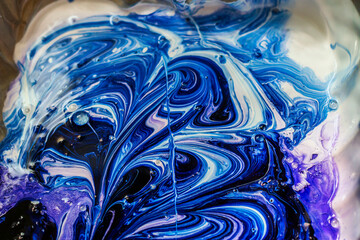 Wavy multi-colored patterns and stains from paint close-up	
