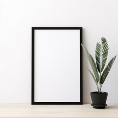 Simple frame mockup for art or photo, black and white, white wall, houseplant