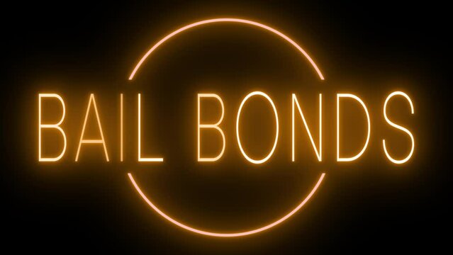 Flickering orange retro style neon sign glowing against a black background for BAIL BONDS