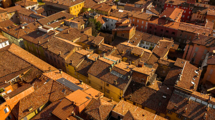 Aerial view of the sloping roofs of the houses in the historic center of Sassuolo, Emilia Romagna, Italy. The orange color of traditional roofs predominates.