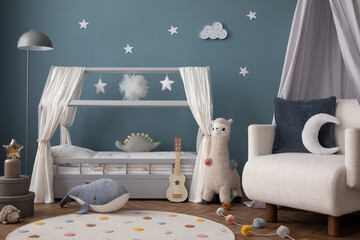 Warm and cozy child room interior with cozy bed, plush lama, white armchair, round rug, blue wall,...