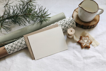 Christmas still life. Greeting card, invitation mockup. Gingerbread cookies, pine tree branches on...
