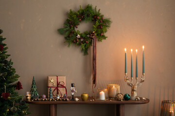 Aesthetic composition of christmas living room interior with wooden console, christmas gifts,...