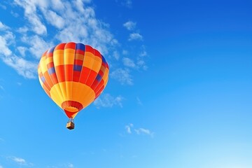 Fototapeta na wymiar balloon soaring high in the clear blue sky