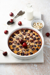 Homemade cherry clafoutis with almond flakes
