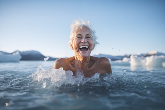 Photo of mature senior woman swims in cold water in winter