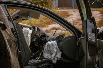 An accident involving a car occurred on a city street. Damaged car. Serious accident. Close-up....