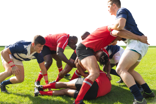 Digital png photo of male rugby players playing on court on transparent background