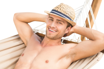Digital png photo of happy caucasian shirtless man lying on hammock on transparent background