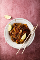 Traditional noodles with shrimps and lime