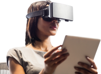 Digital png photo of biracial woman using vr headset and tablet on transparent background