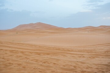 Fototapeta na wymiar Scenic view of sand dunes at sunset in Erg Chebbi desert, Sahara Desert, in Morocco