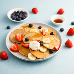 Homemade pancakes with banana and berries