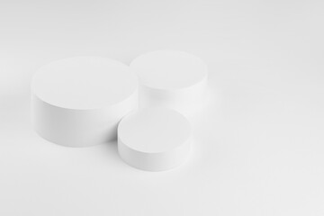Abstract three white round podiums for cosmetic products, mockup on white background. Scene for presentation products, gifts, goods, advertising, design, sale, display, showing in simplicity style.